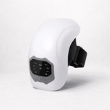 Cordless knee massager device with control panel for adjustable heat and massage settings.