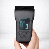 Close-up of a hand holding the control panel for VascuForce™ wireless recovery boots with digital display.